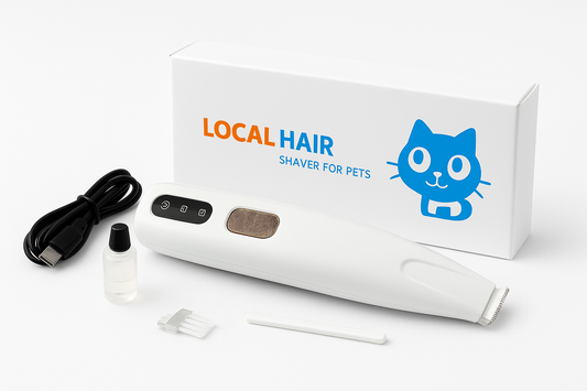 A white electric pet shaver with a gold button and black controls is shown next to its white box with a "LOCAL HAIR" logo and a smiling blue cat illustration. Also included are a black USB charging cable, a small bottle of lubricating oil, and a white cleaning brush.